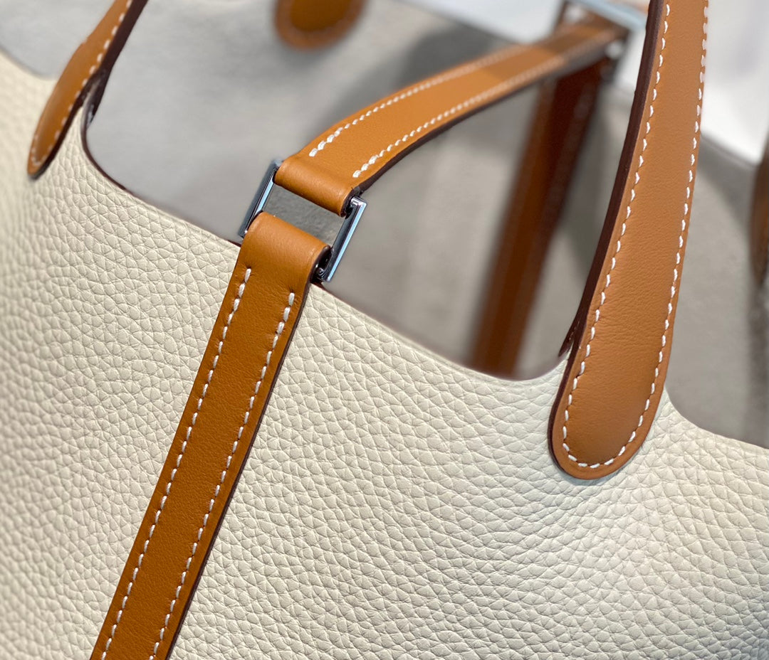 HERMES 25S PICOTIN LOCK 18 IN BURNT ORANGE AND IVORY CALFSKIN SILVER HARDWARE
