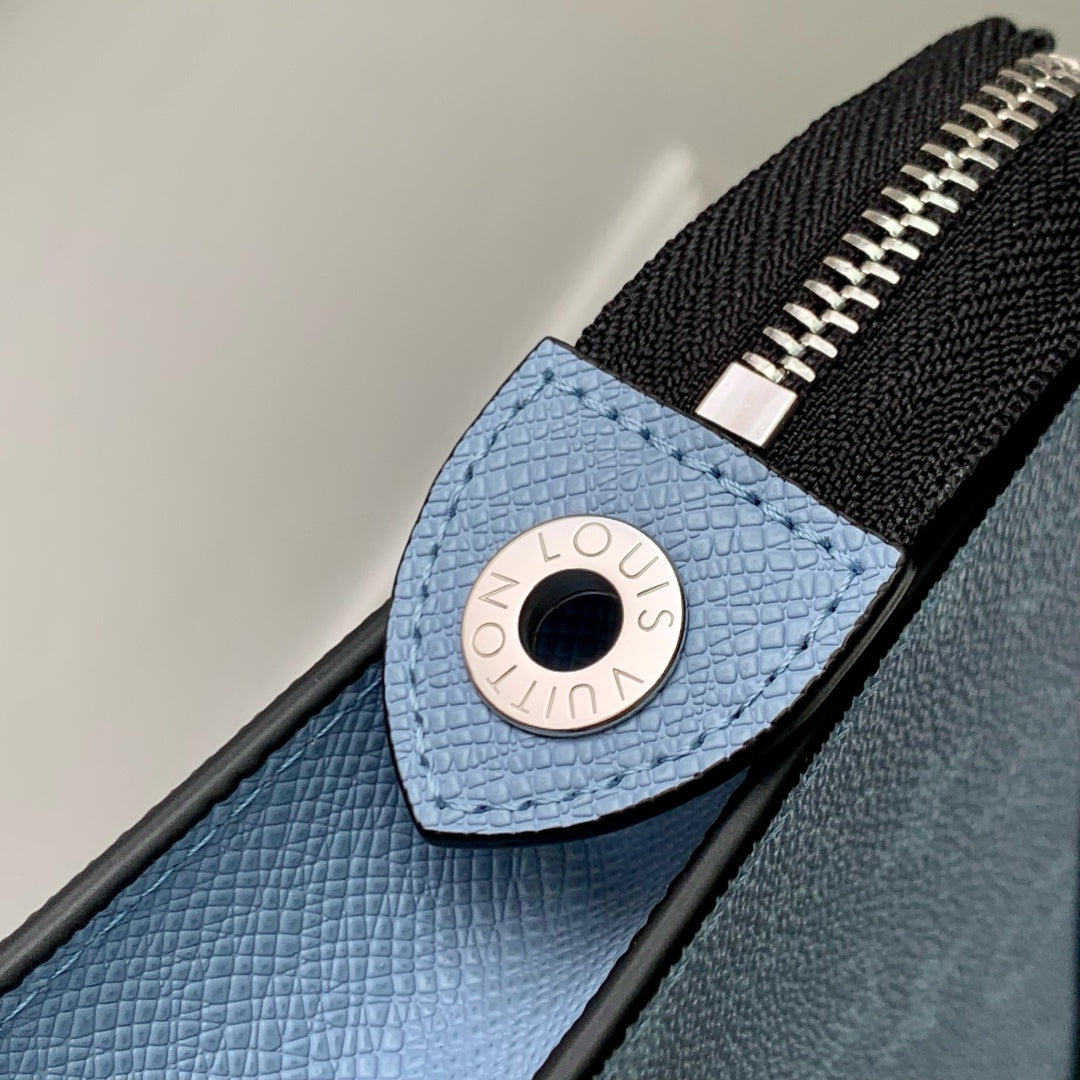 POCHETTE VOYAGE 26 IN LIGHT BLUE MONOGRAM ECLIPSE CALFSKIN