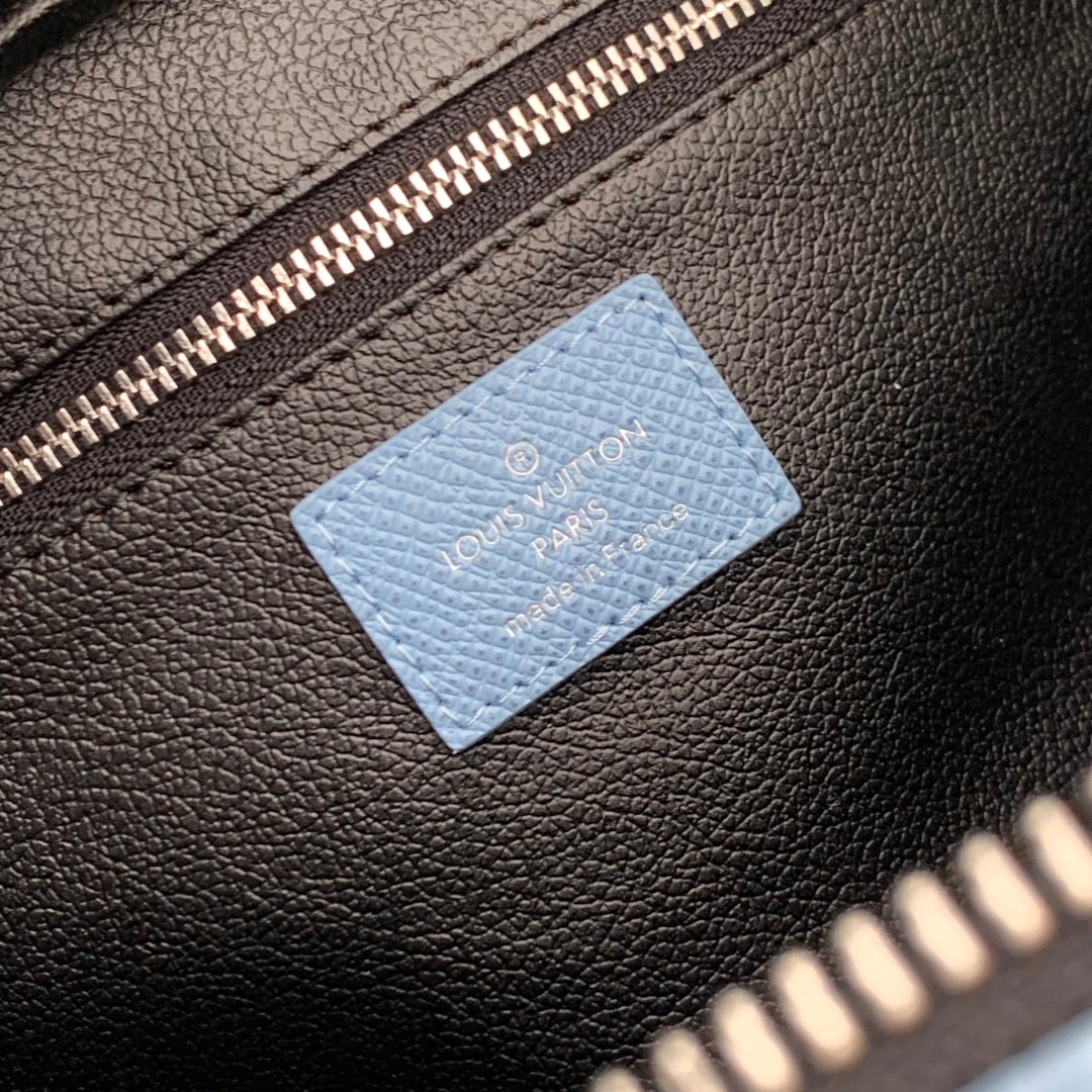 DOPP KIT 28 IN BLUE MONOGRAM COATED CANVAS