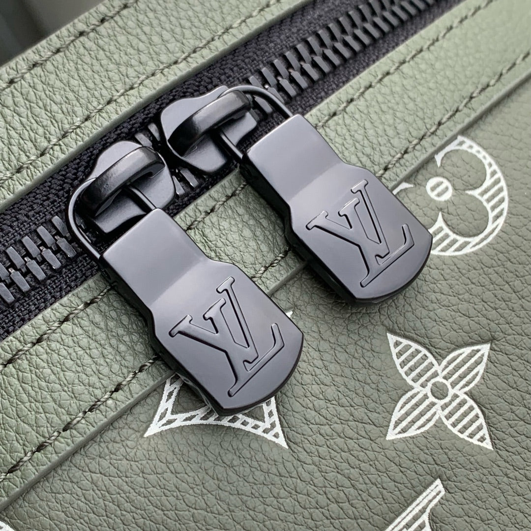 DISCOVERY PM BACKPACK 38 IN OLIVE GREEN MONOGRAM LAMBSKIN