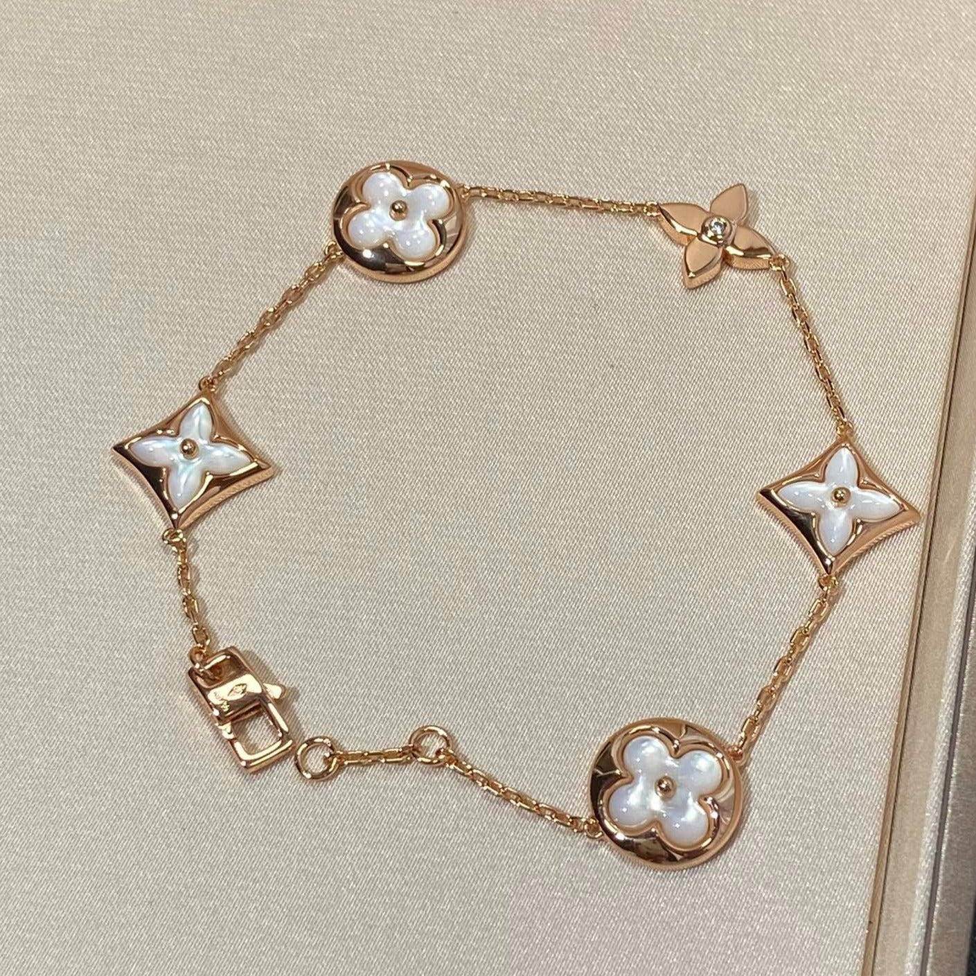[AURORA]STAR AND SUN 5 MOTIF MOP PINK GOLD BRACELET