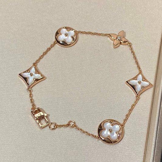 [AURORA]STAR AND SUN 5 MOTIF MOP PINK GOLD BRACELET