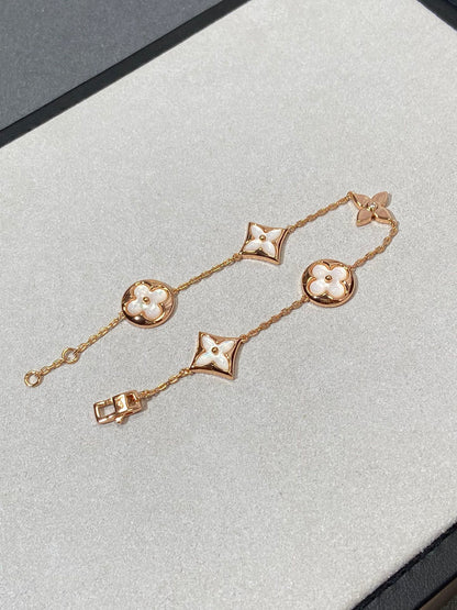 [AURORA]STAR AND SUN 5 MOTIF MOP PINK GOLD BRACELET