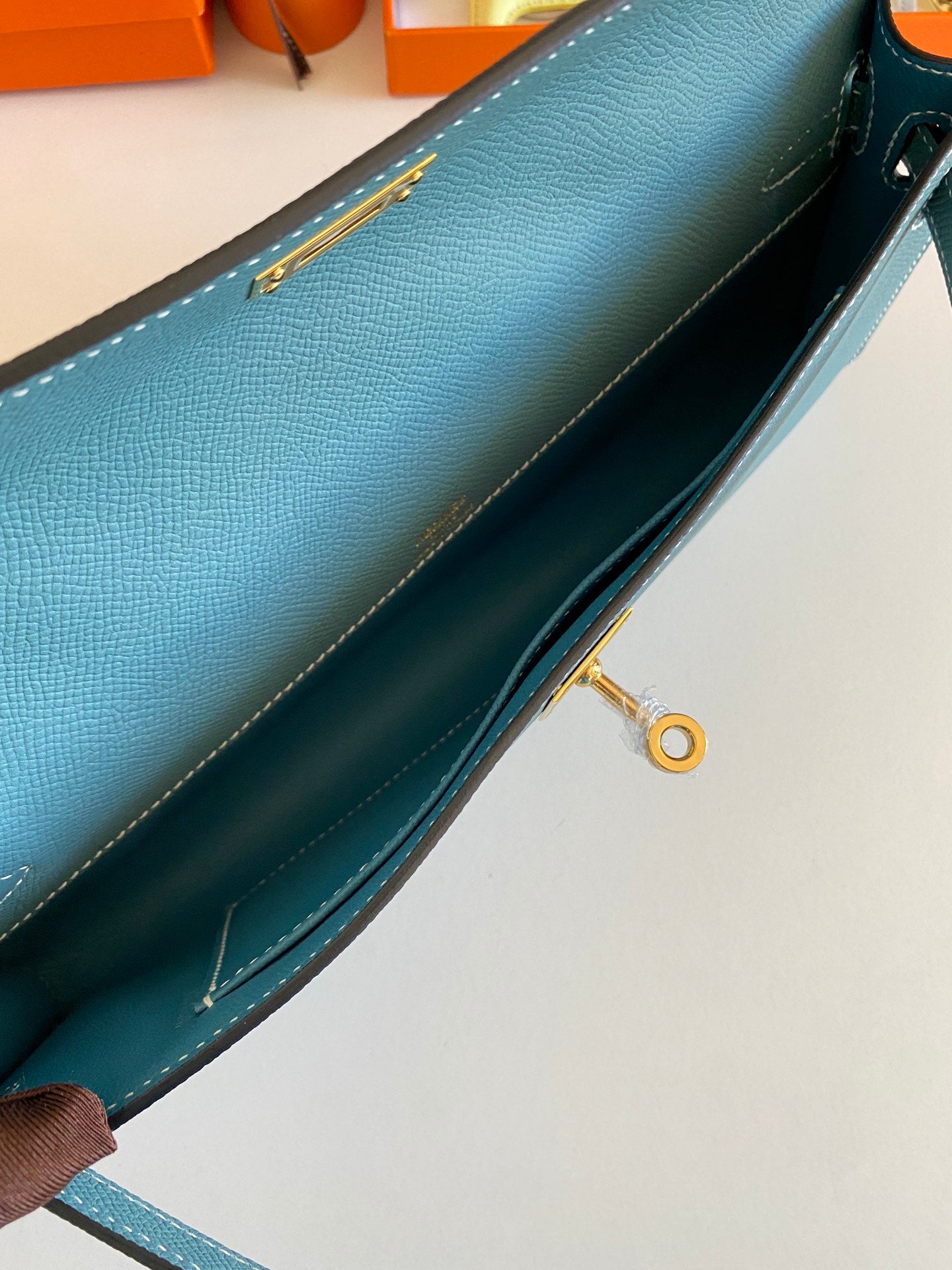 KELLY CUT 31 IN AZURE BLUE CALFSKIN WITH GOLD HARDWARE
