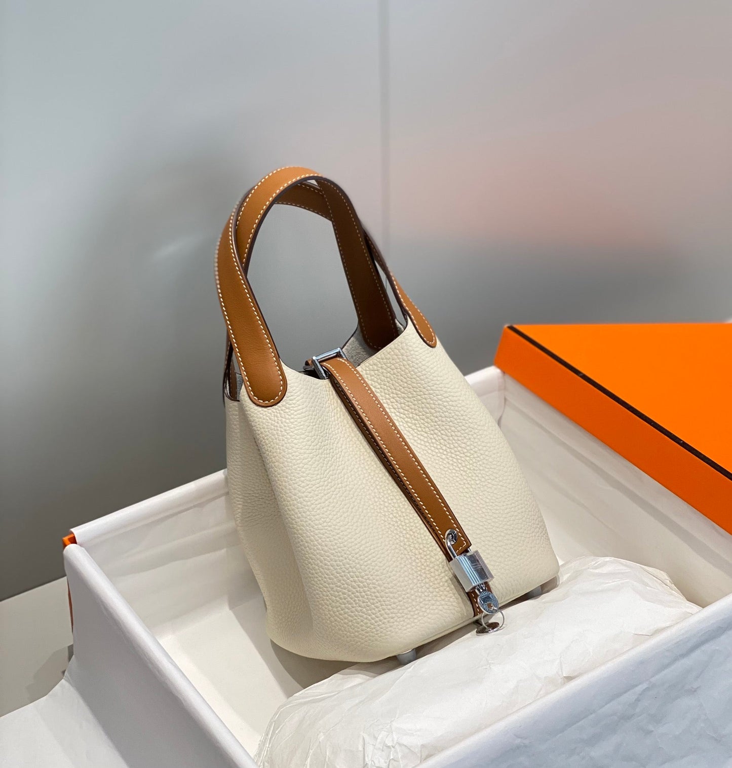 HERMES 25S PICOTIN LOCK 18 IN BURNT ORANGE AND IVORY CALFSKIN SILVER HARDWARE