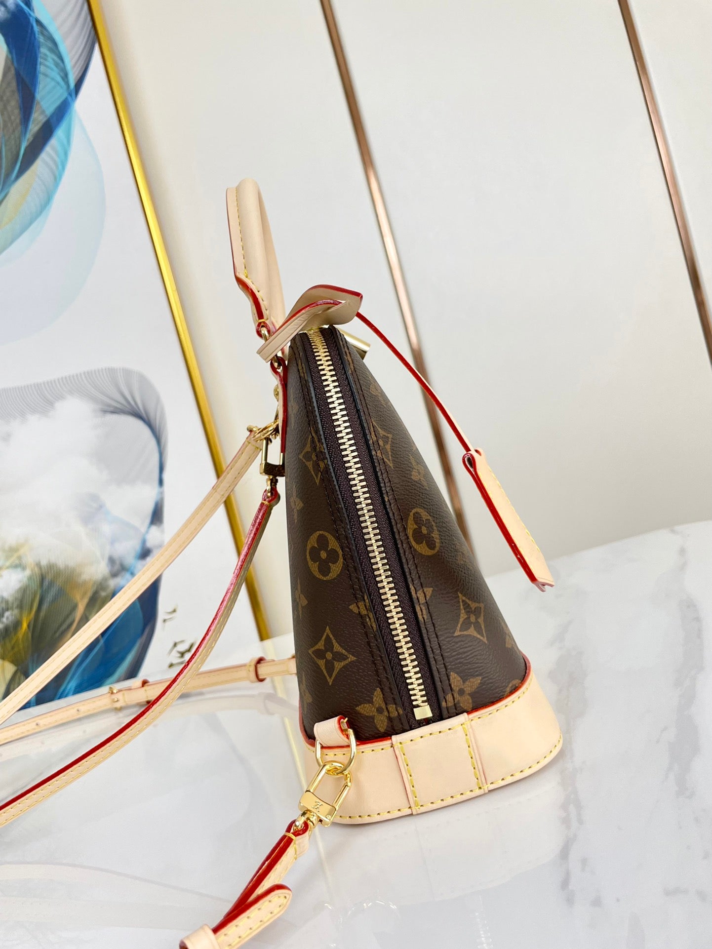 ALMA BACKPACK 20 IN BROWN MONOGRAM CANVAS AND BEIGE CALFSKIN TRIM GOLD BUCKLE