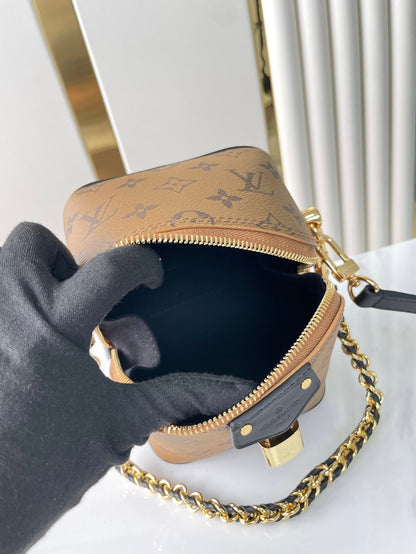 JUST IN CASE 14 IN BROWN MONOGRAM REVERSE CANVAS GOLD HARDWARE