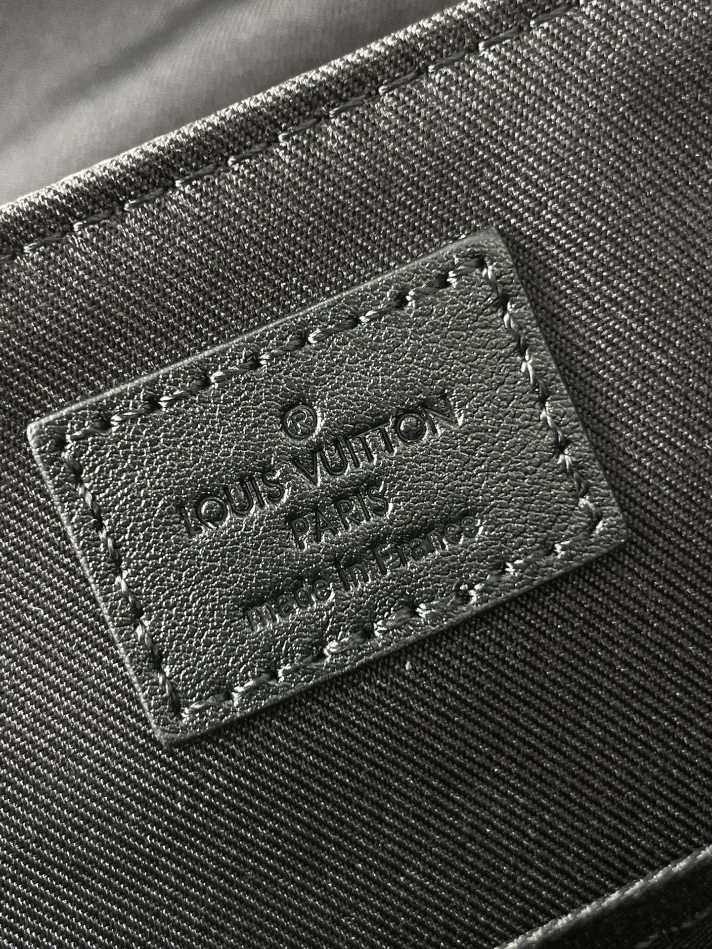 MESSENGER VOYAGER PM 33 IN GUN METAL MONOGRAM ECLIPSE CANVAS