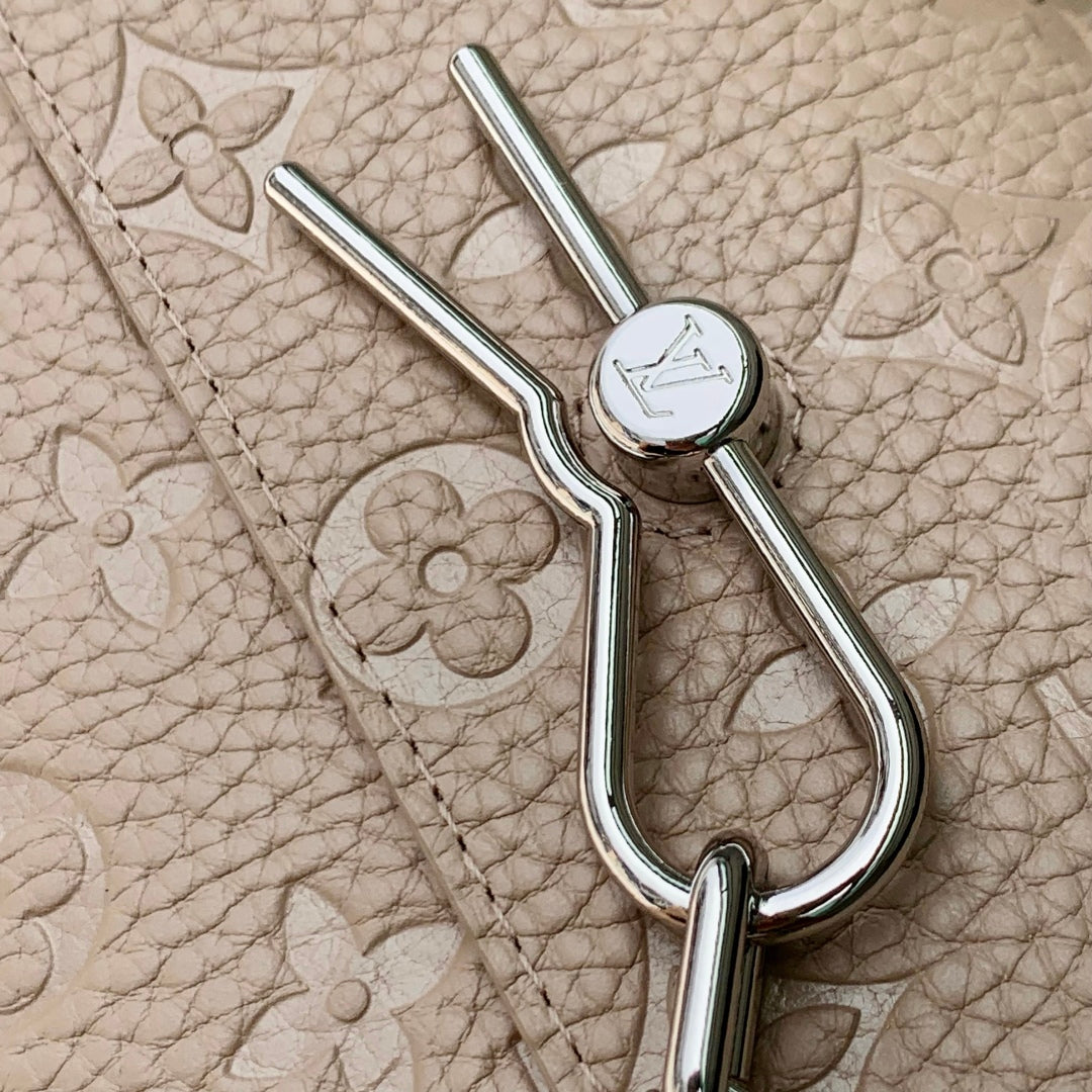 STEAMER WEARABLE WALLET 18 IN LIGHT BROWN MONOGRAM TAURILLON CALFSKIN