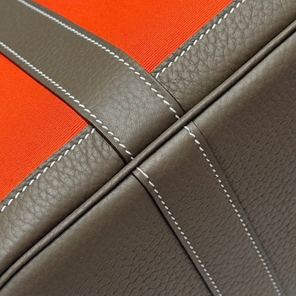 GARDEN PARTY 30CM IN ORANGE MINIMUM TOILETS COTTON CANVAS AND BROWN CALFSKIN