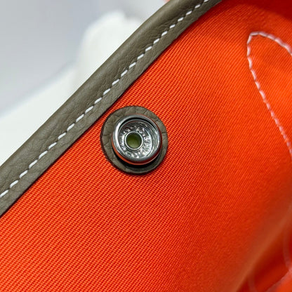 GARDEN PARTY 30CM IN ORANGE MINIMUM TOILETS COTTON CANVAS AND BROWN CALFSKIN