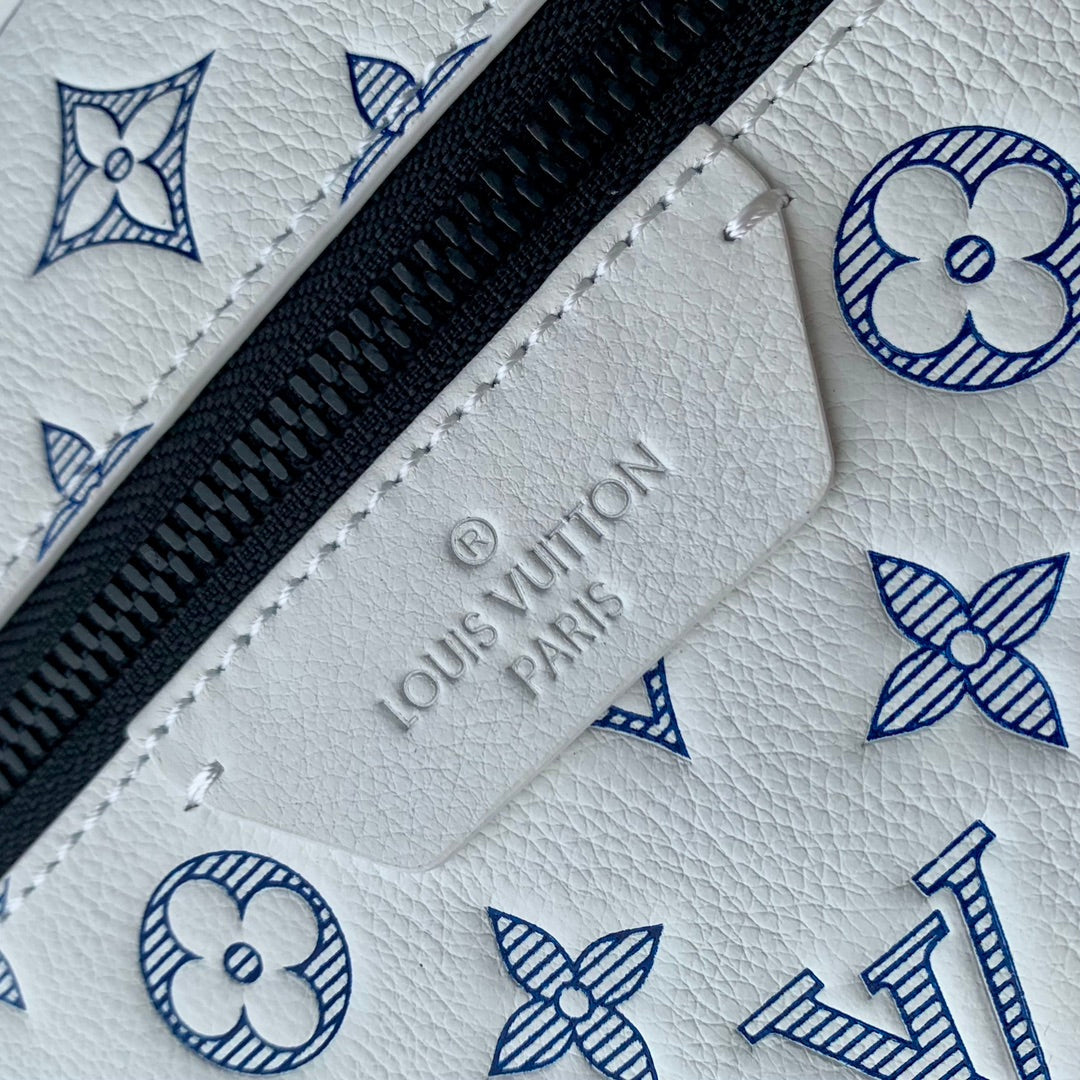 DISCOVERY PM BACKPACK 38 IN WHITE MONOGRAM LAMBSKIN