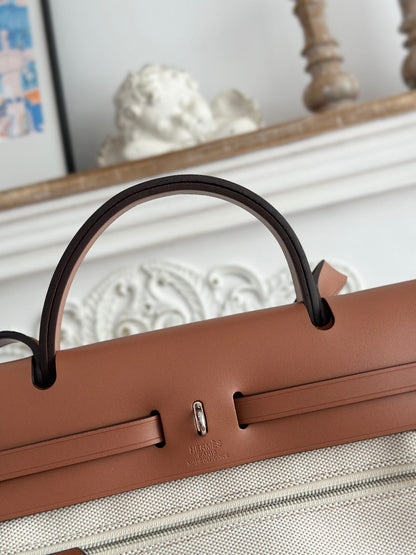 HERBAG ZIP 31 RETOURNE PEGASE POP BAG IN OFF-WHITE MIX RED CANVAS AND HUNTER COWHIDE